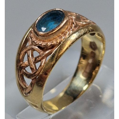 302 - 9ct gold Clogau Celtic design ring set with blue topaz. 5.5g approx. Size Q1/2. (B.P. 21% + VAT)