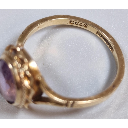 306 - 9ct gold and purple stone dress ring. 2.2g approx. Size M. (B.P. 21% + VAT)