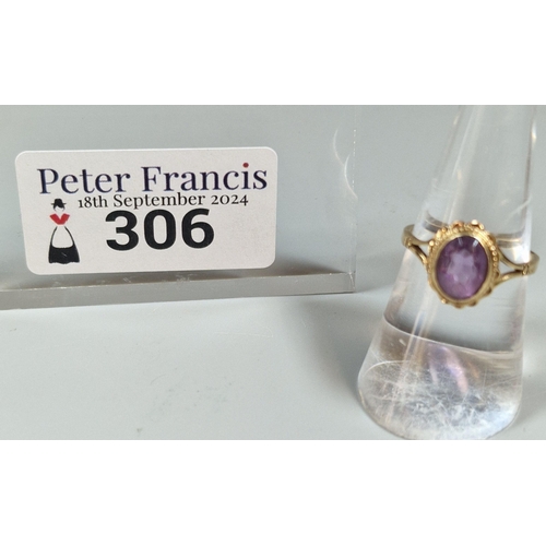 306 - 9ct gold and purple stone dress ring. 2.2g approx. Size M. (B.P. 21% + VAT)