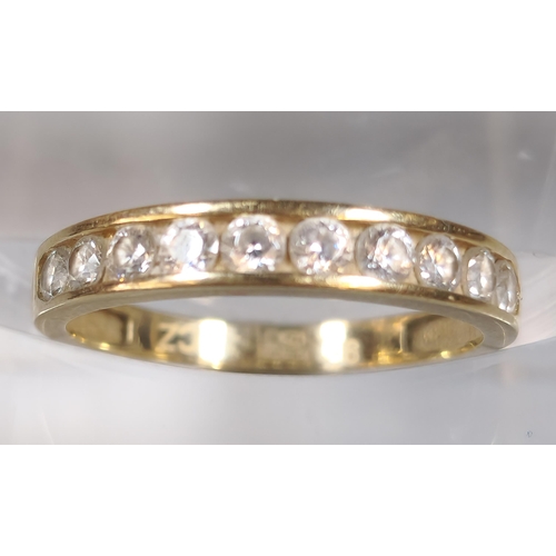 307 - 9ct gold and cubic zirconia half eternity style ring. 1.1g approx. Size J. (B.P. 21% + VAT)