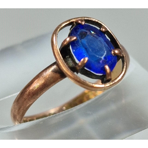 308 - 9ct gold and blue stone dress ring. 1.3g approx. Size I. (B.P. 21% + VAT)