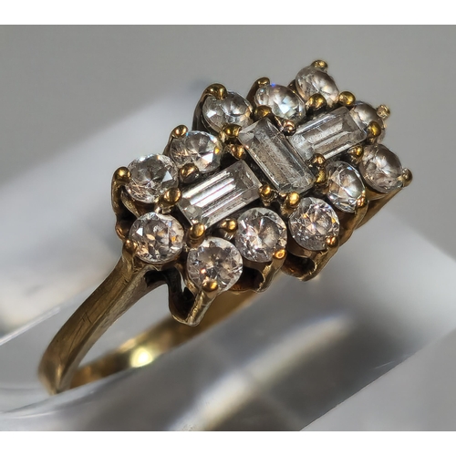 309 - 9ct gold multi-cluster clear stone dress ring. 2.8g approx. Size J. (B.P. 21% + VAT)