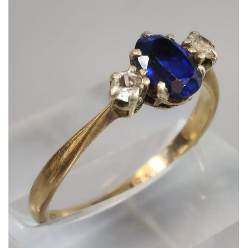 310 - 9ct gold blue and clear stone dress ring. 2.1g approx. Size R. (B.P. 21% + VAT)