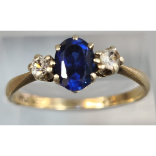 310 - 9ct gold blue and clear stone dress ring. 2.1g approx. Size R. (B.P. 21% + VAT)