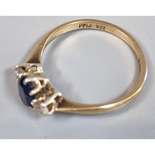 310 - 9ct gold blue and clear stone dress ring. 2.1g approx. Size R. (B.P. 21% + VAT)