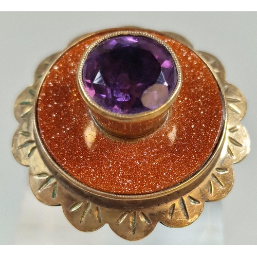 322 - 9ct gold modernist design purple stone dress ring. 9.5g approx. Size Q1/2. (B.P. 21% + VAT)