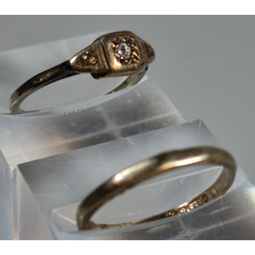 327 - 9ct gold wedding band. 1.1g approx. Together with a gold indistinctly marked ring inset with a tiny ... 