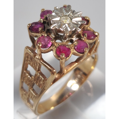 328 - 9ct gold ruby and diamond flowerhead cluster ring. 4.7g approx. Size O. (B.P. 21% + VAT)