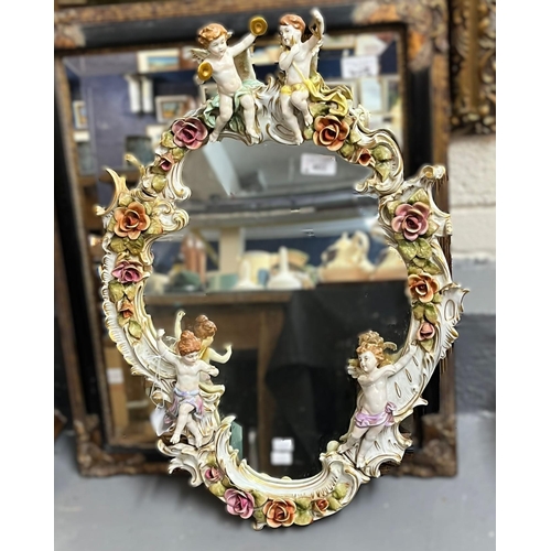 402 - German Dresden porcelain cherub mounted mirror with overall C scroll and flowerhead decoration, poss... 