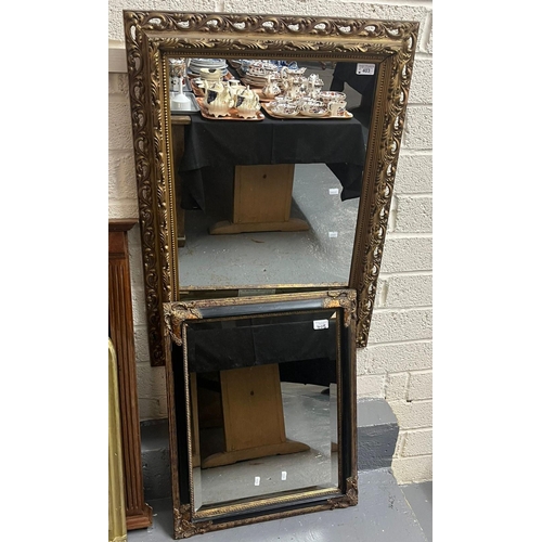 403 - Two rectangular framed mirrors. One with pierced gilded frame, one having beveled plate with black a... 