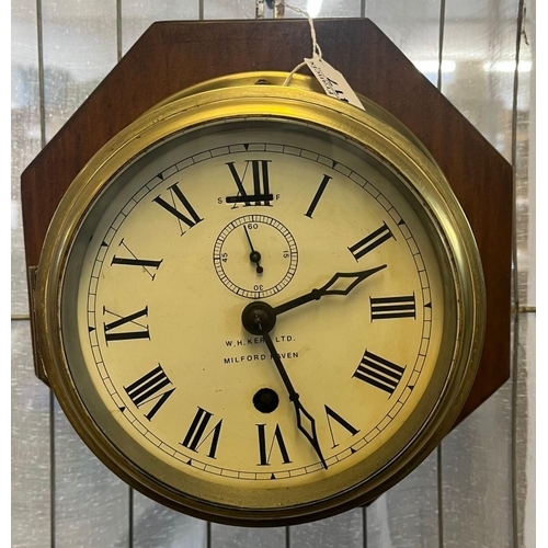 417 - Early 20th century brass marine bulkhead clock marked W H Kerr Ltd Milford Haven, now mounted on woo... 