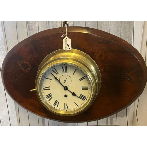 418 - Large marine brass bulkhead clock with white Roman face having seconds dial, now mounted on substant... 