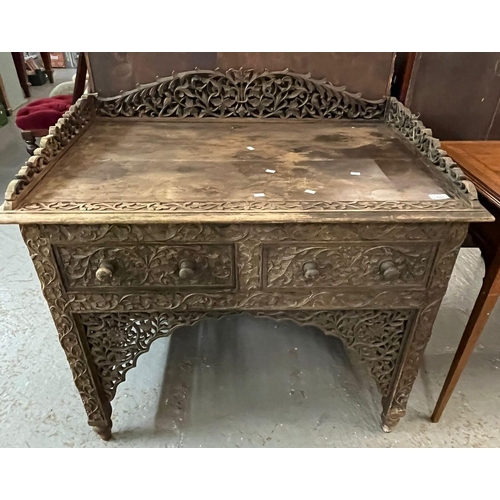 440 - Indo Burmese carved hardwood side table, having foliate pierced galleried top above two frieze drawe... 