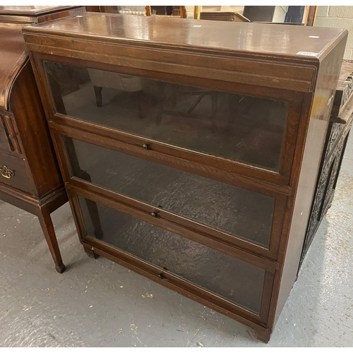 441 - Mid century oak four section Globe Wernicke style bookcase with up-over glazed doors. 90cm wide appr... 