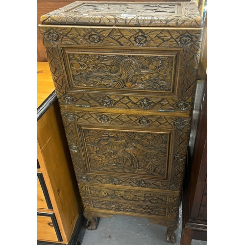 443 - Small Japanese carved drinks cabinet with fall front, overall decoration of Cranes amongst clouds an... 