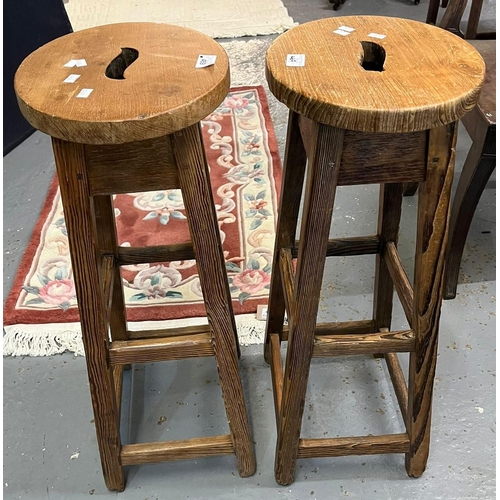 469 - Pair of pine school type high stools with slotted oval seats. (2) (B.P. 21% + VAT)