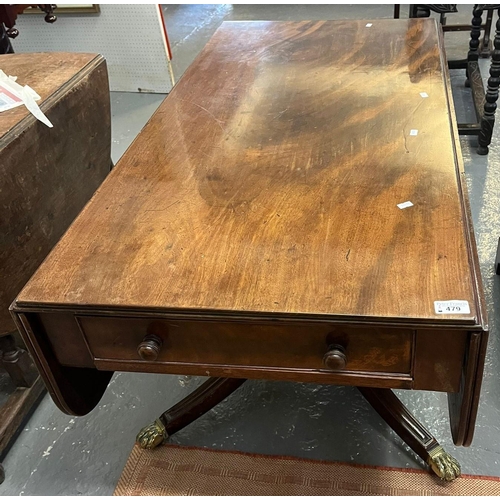 479 - Regency period mahogany drop leaf breakfast table on brass paw feet and casters. (B.P. 21% + VAT)