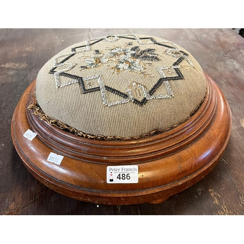 486 - Victorian mahogany framed circular foot stool with beadwork padded upholstery. 36cm diameter approx.... 