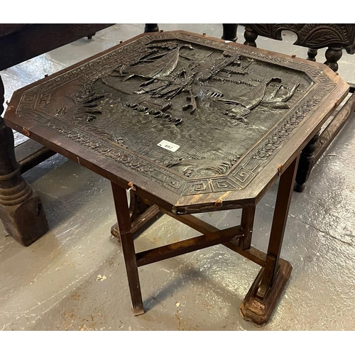 497 - Chinese hardwood folding table of square form, the top deeply carved with immortals amongst pagodas,... 