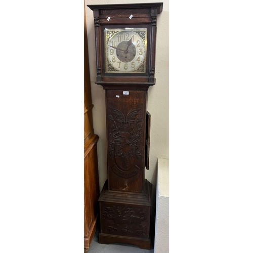 501 - 20th century oak cased three train grandmother clock striking on gongs with Llanelli armorial carved... 