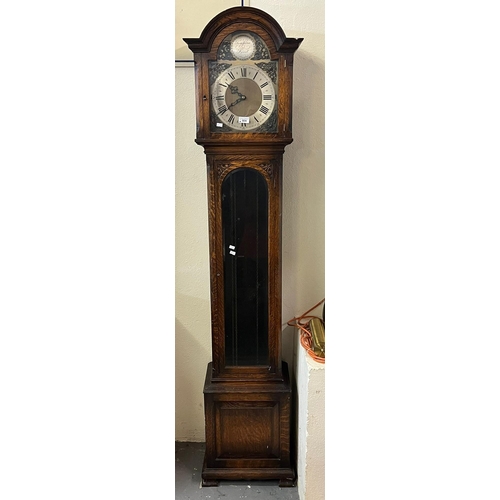 504 - 20th century oak Grandmother clock having arched face with silvered Roman chapter ring above glazed ... 