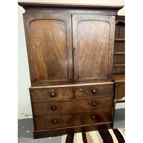 506 - Victorian mahogany two stage press cupboard, having moulded cornice over two blind panelled doors wi... 