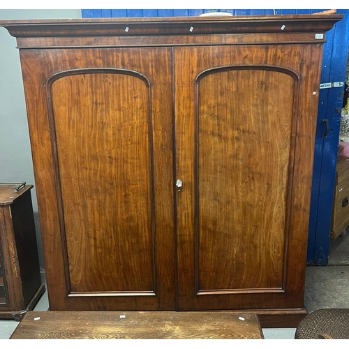 515 - Victorian mahogany two section wardrobe, having fitted interior with sliding shelves and drawers on ... 