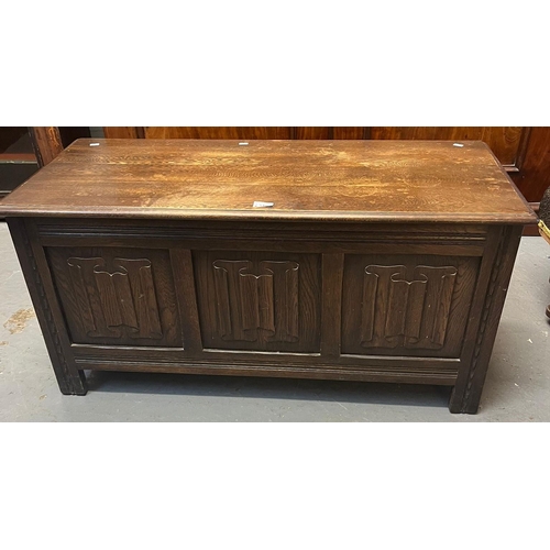 516 - Reproduction oak coffer/chest, with moulded edge hinged top over three raised and fielded panels, on... 