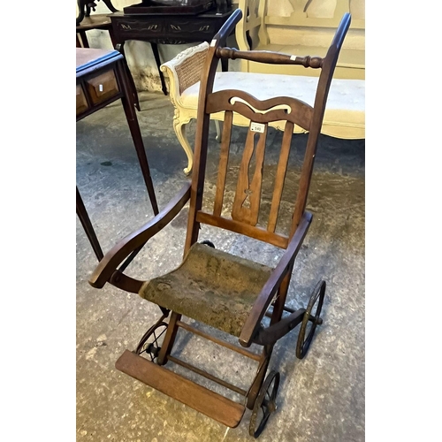 540 - 19th century child's folding push chair with carpet seat and spoked wheels. (B.P. 21% + VAT)