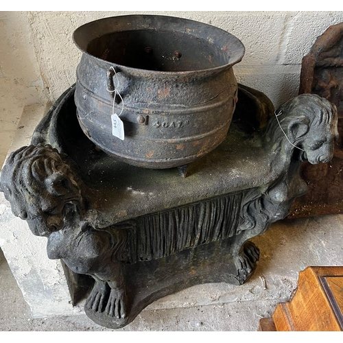 544 - Cast metal cauldron, composition stone garden figure/fountain head and a composition garden seat wit... 