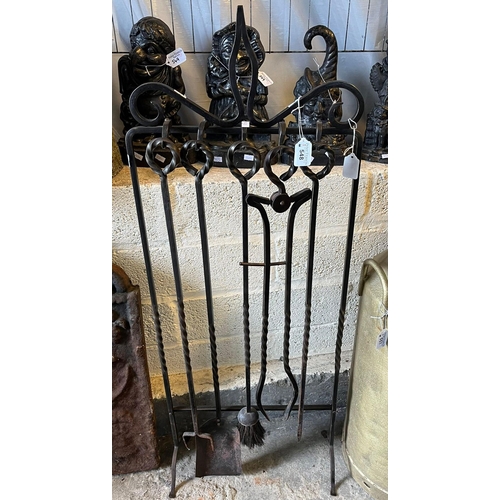 548 - Well made wrought iron multi implement companion stand. (B.P. 21% + VAT)