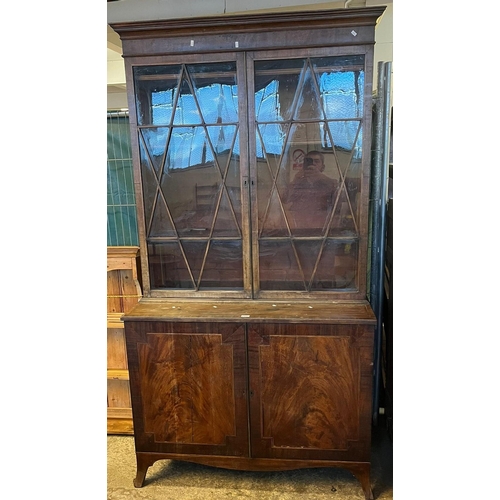 561 - Early 19th century mahogany chiffonier bookcase, having moulded cornice above two glazed doors with ... 