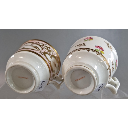 87 - Two 19th century Swansea porcelain coffee cups, one painted with pink gilt flowers and wide oak leav... 