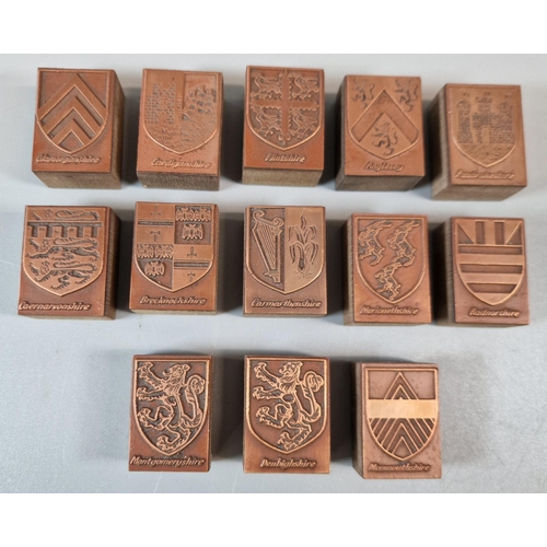 97 - A vintage Manikin cigar box containing a collection of engraved copper printing blocks being the Cou... 