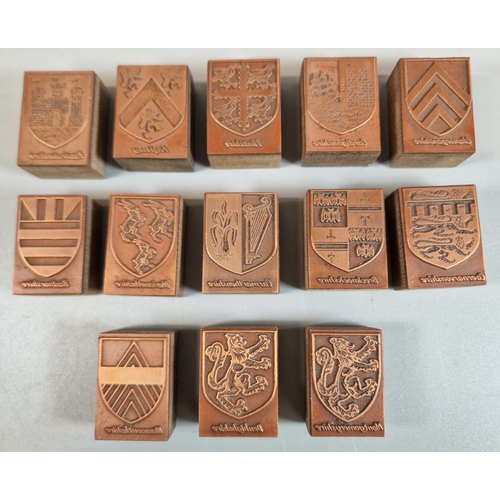 97 - A vintage Manikin cigar box containing a collection of engraved copper printing blocks being the Cou... 