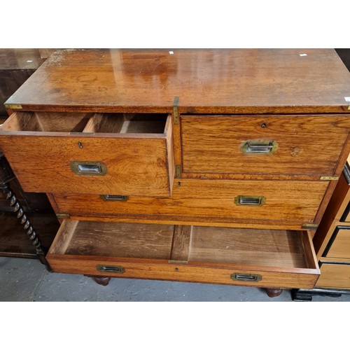 445 - Victorian teak military Campaign Chest, having brass corners, bands and recessed handles, in two sec... 