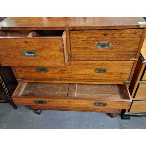 445 - Victorian teak military Campaign Chest, having brass corners, bands and recessed handles, in two sec... 