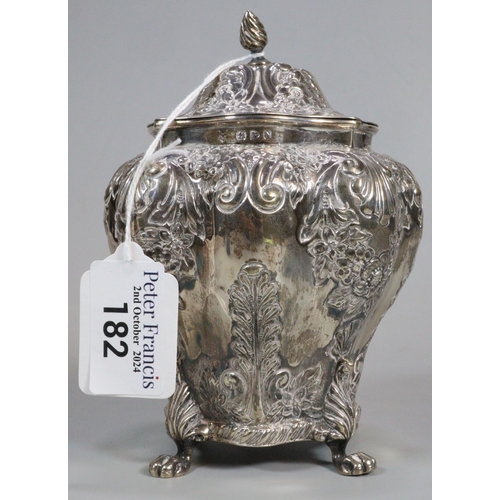 182 - Late Victorian silver repoussé tea caddy on four paw feet. Chester 1896. Maker's mark initial R H. 8... 