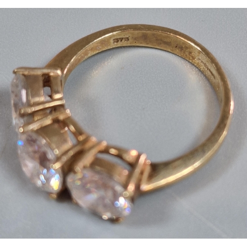 196 - 9ct gold three stone cubic zirconia dress ring. 4.5g approx. Size M. (B.P. 21% + VAT)