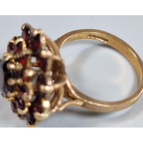 197 - 9ct gold garnet multi cluster flowerhead ring (one stone missing). 5.3fg approx. Size M. (B.P. 21% +... 