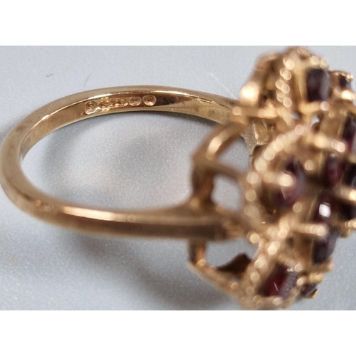 198 - 9ct gold garnet multi cluster flowerhead ring. 4.1g approx. Size K. (B.P. 21% + VAT)