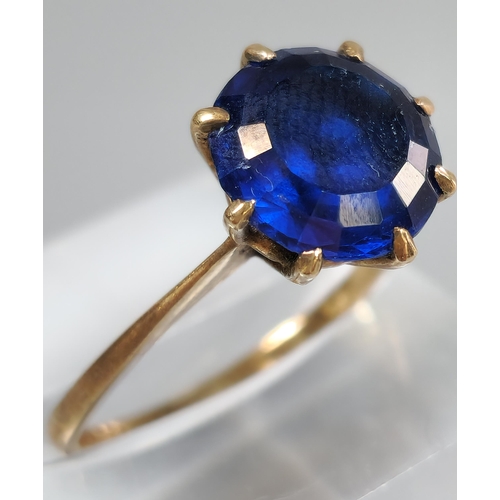 202 - 9ct gold blue stone dress ring. 2.7g approx. Size N1/2. (B.P. 21% + VAT)