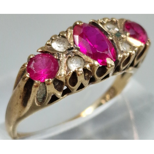 204 - 9ct gold red and clear stone dress ring. 3.4g approx. Size P. (B.P. 21% + VAT)