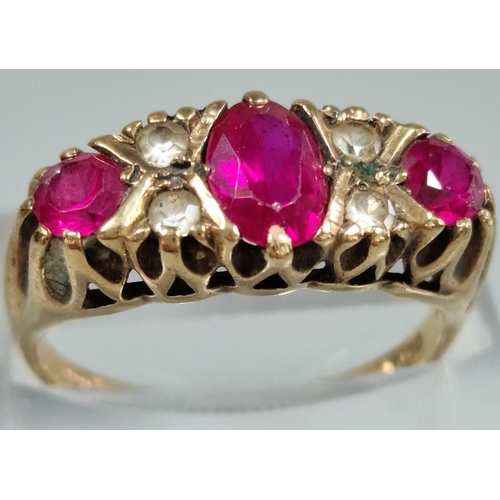 204 - 9ct gold red and clear stone dress ring. 3.4g approx. Size P. (B.P. 21% + VAT)