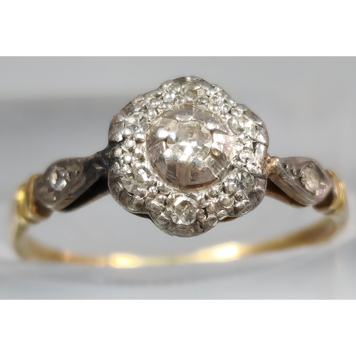 205 - 18ct gold and platinum diamond flowerhead ring. 1.7g Size I1/2. (B.P. 21% + VAT)