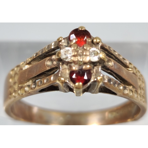 211 - 9ct gold red and clear stone dress ring. 3.2g approx. Size P. (B.P. 21% + VAT)