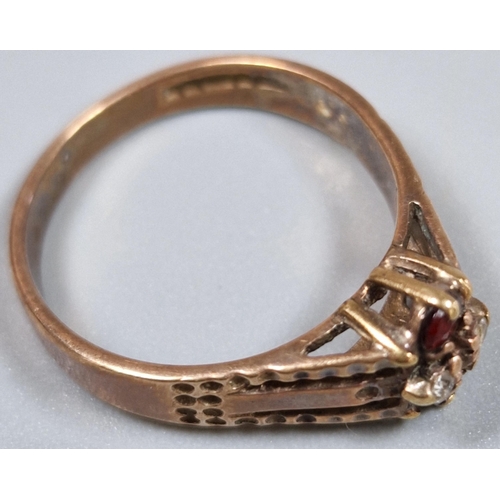 211 - 9ct gold red and clear stone dress ring. 3.2g approx. Size P. (B.P. 21% + VAT)