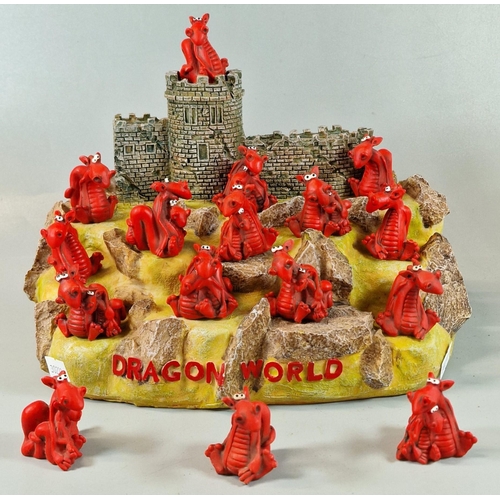 22 - Modern resin and composition 'Dragonworld' castle sculpture with rock work and novelty dragons. (B.P... 