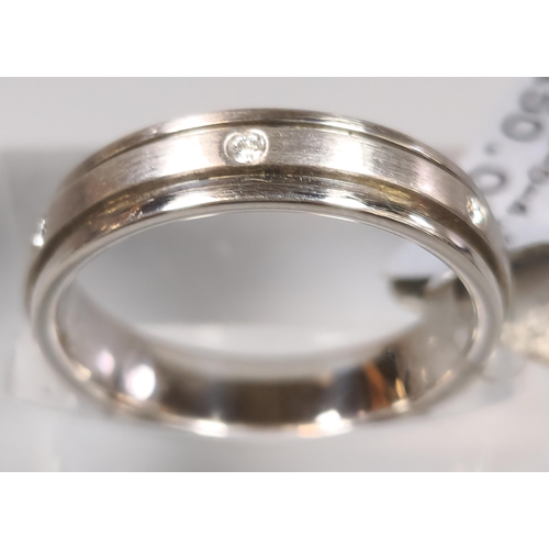 220 - Diamond and platinum wedding band. In ring box. 7g approx. Size L. (B.P. 21% + VAT)