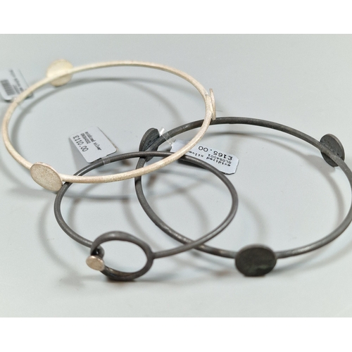 223 - Silver modernist design globe bangle together with an oxidized silver globe bangle and a small oxidi... 